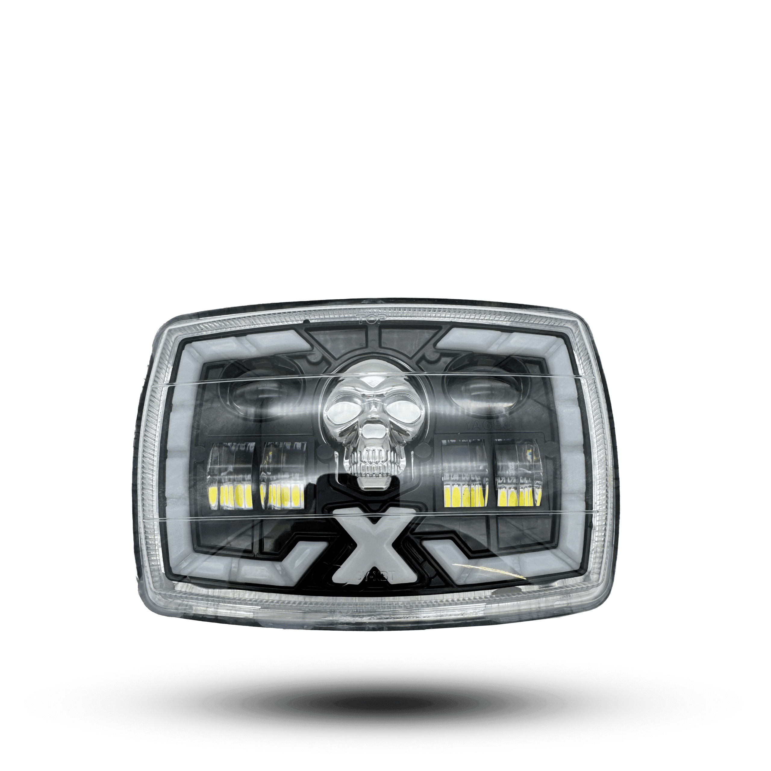 led beam skull mini headlight: rectangular chrome headlight with a skull design in the center and an "X" below it, surrounded by a white led halo.