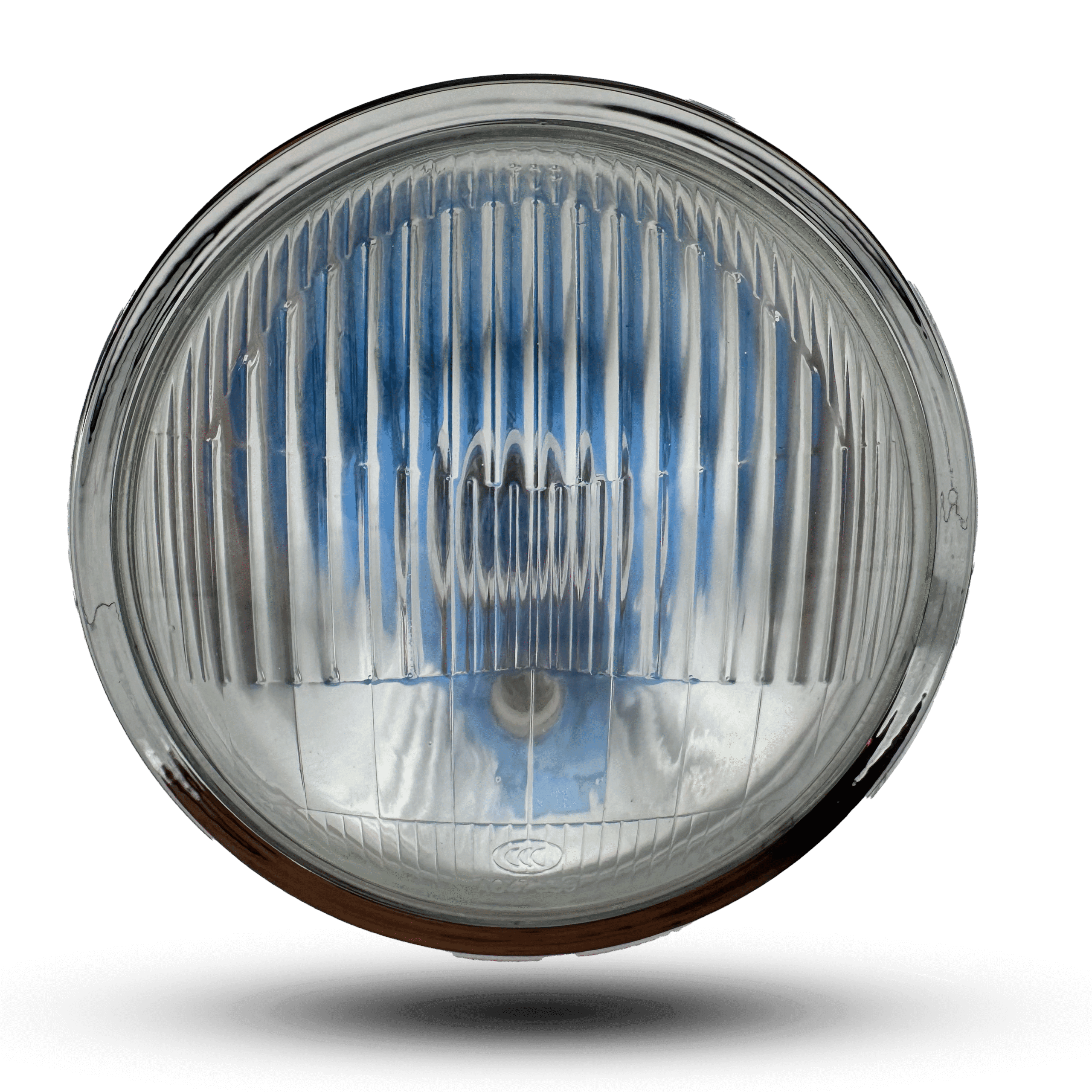 Round head light with a shiny chrome bezel and vertically ribbed clear lens, reflecting a blue sky