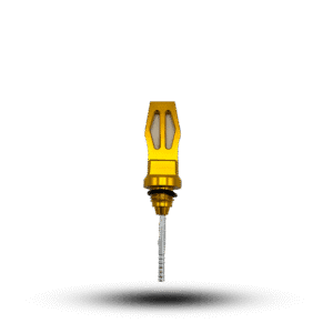 Close-up of a yellow oil gauge CNC, showcasing its metallic silver dipstick with measurement markings against a stark black background. The oil gauge features a machined handle and a precise, functional design.