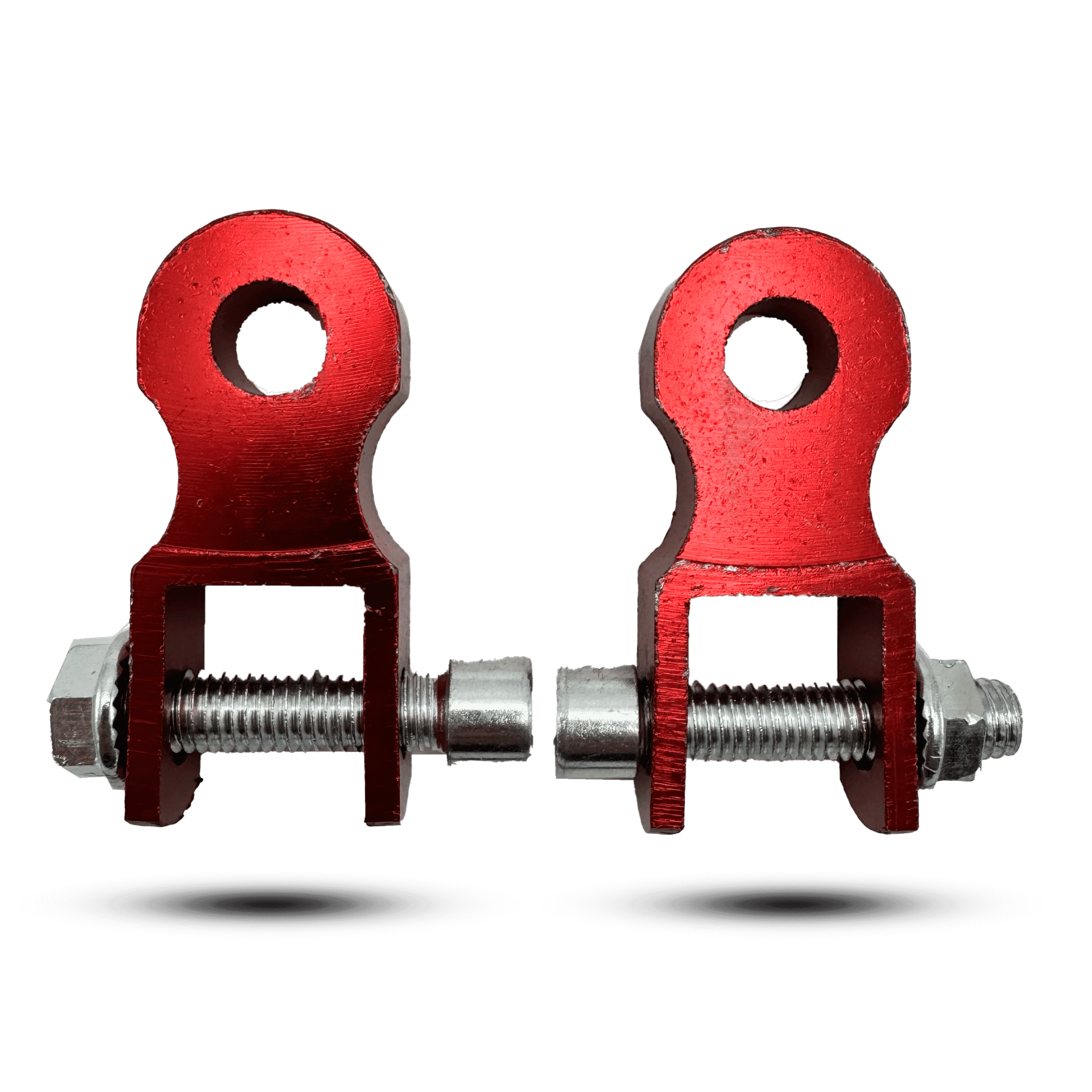 Pair of red shock riser components with bolts and nuts, for motorcycle suspension adjustment