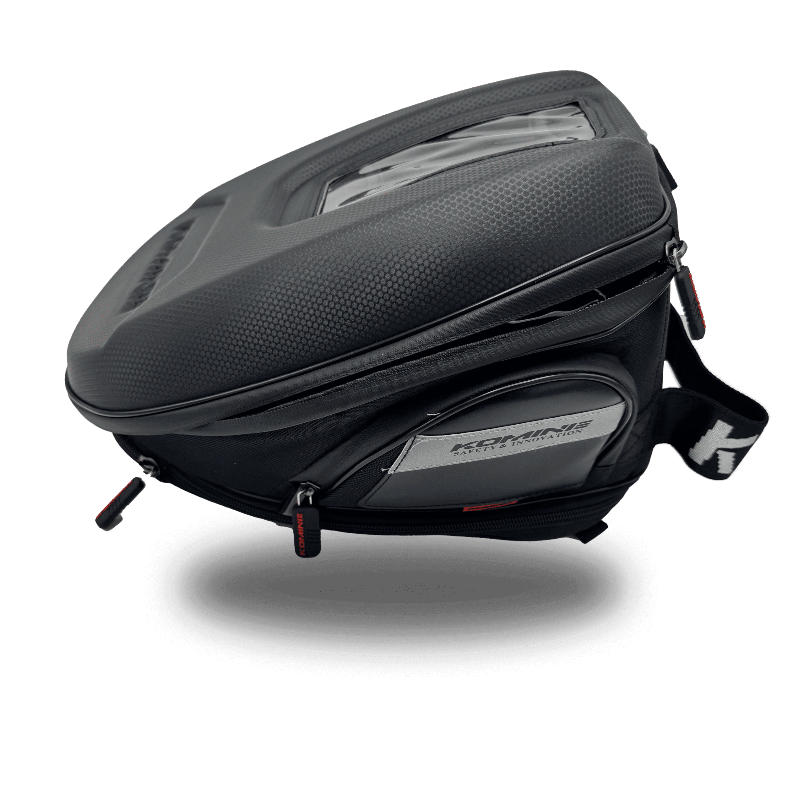 Black komine tank bag with a textured top, clear map pocket, and red zipper pulls. Ideal for motorcycle travel.