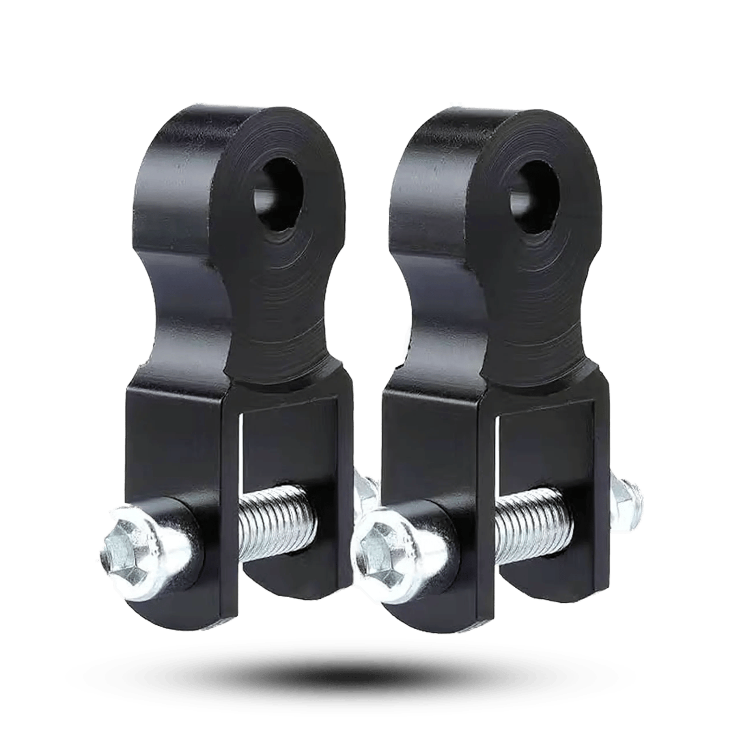 Pair of black CNC aluminum motorcycle rear shock absorber height risers with silver mounting bolts on a black background.