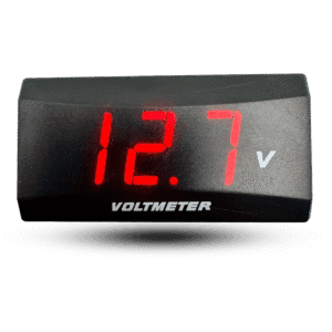 Digital led panel ast voltmeter displays 12.7 volts in bright red on a black panel.