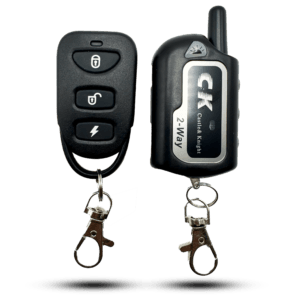 Black ck 2-way remote alarm system remotes. One is a four-button remote, the other has an antenna and a metallic label with the logo. Both have a keychain clip.