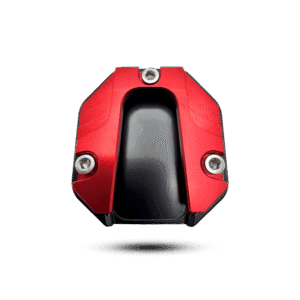 Red aluminum side stand cover with black base and silver bolts, a durable motorcycle accessory.