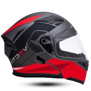 Side view of a matte grey and black modular flip-up motorcycle helmet featuring sharp red geometric designs, a clear visor, and a technical halftone graphic pattern.